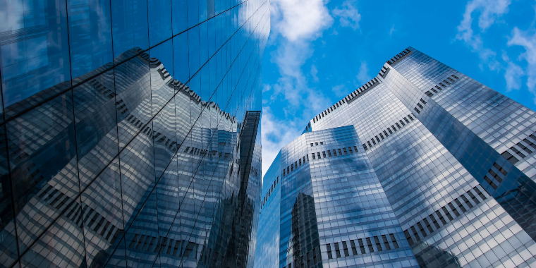 Skyscrapers seen from below. Read the EU Court ruling on the non-deductibility of losses of a permanent establishment.